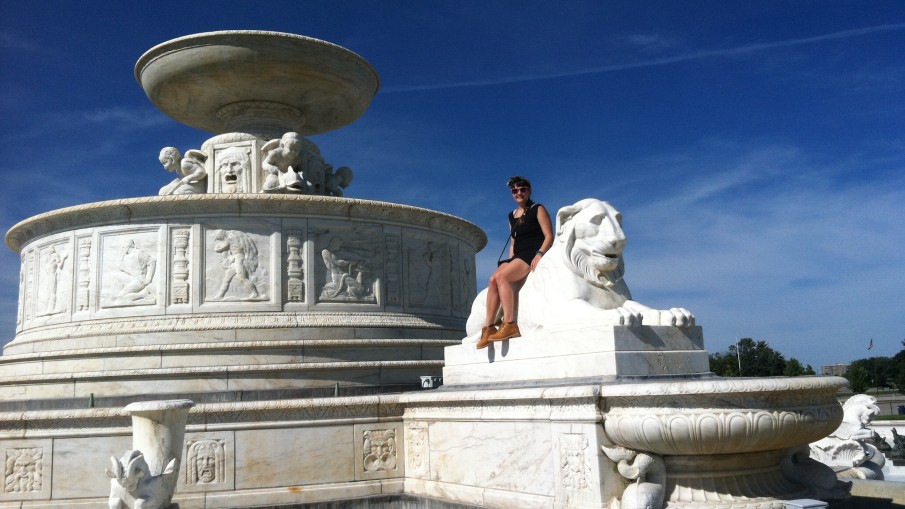 Alexa Dexa sits on a lion statue that is part of the fabulous, giant fountain on Belle Isle (when the fountain was off).