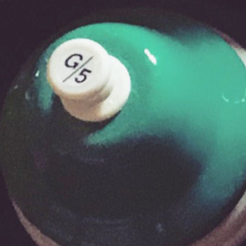 a teal desk bell pitched to G